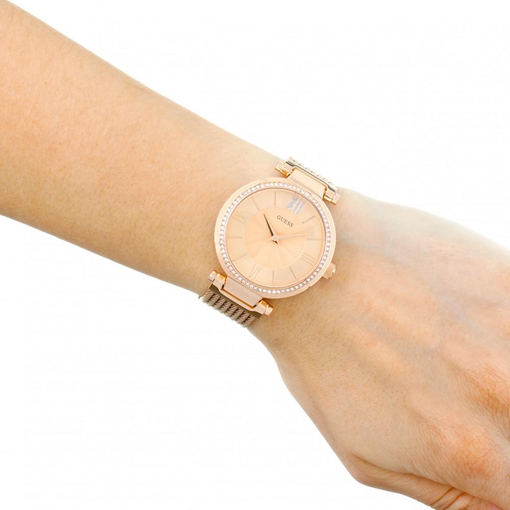 Guess diamond rose gold ladies watch worn on wrist with crystal bezel