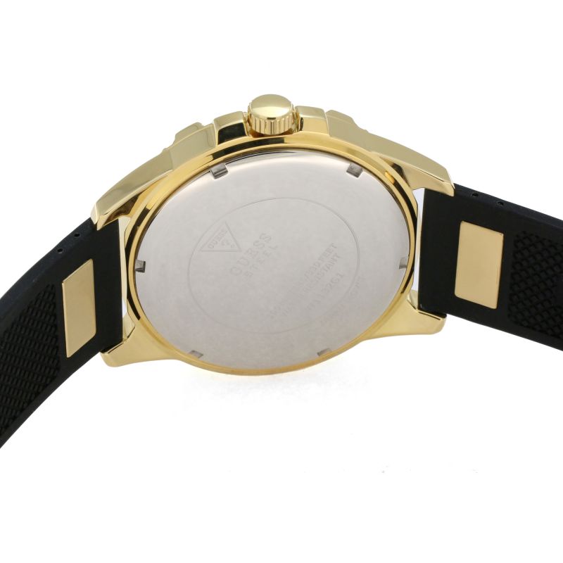 Watch caseback showing Guess branding and engraved details