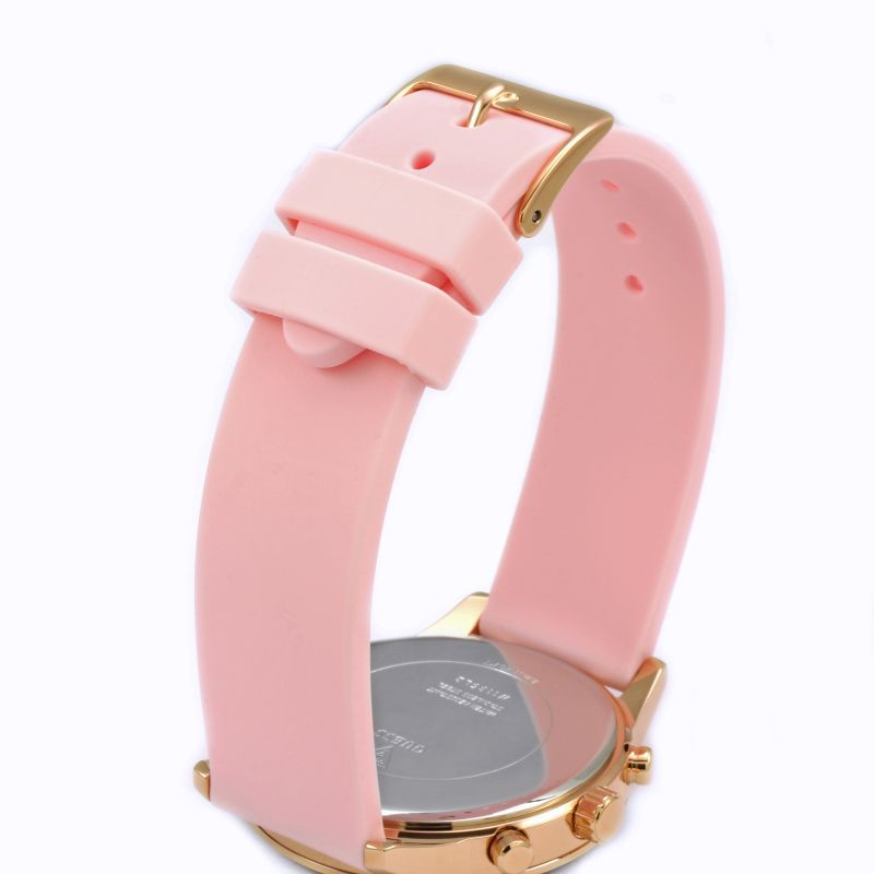 Side view of rose gold case with pink silicone strap and chronograph subdials