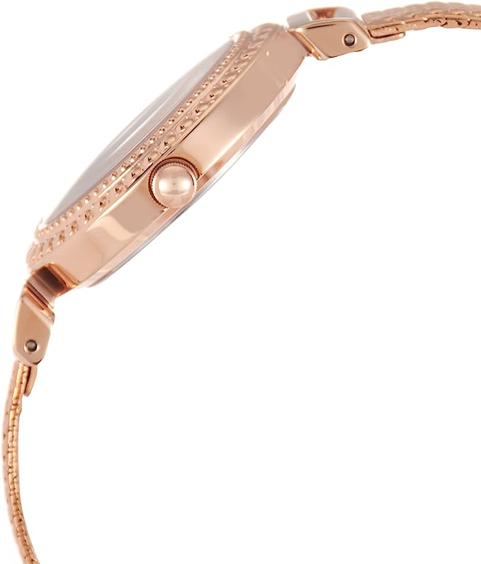 Side profile of rose gold watch showing crystal-decorated bezel and mesh bracelet