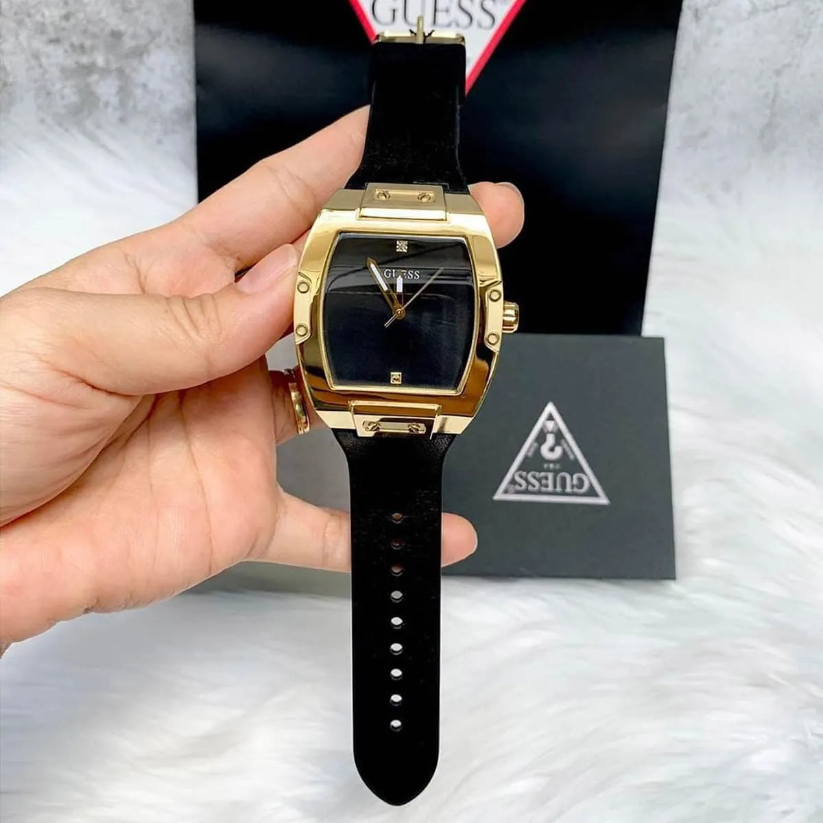 Guess Phoenix watch displayed with packaging box and case