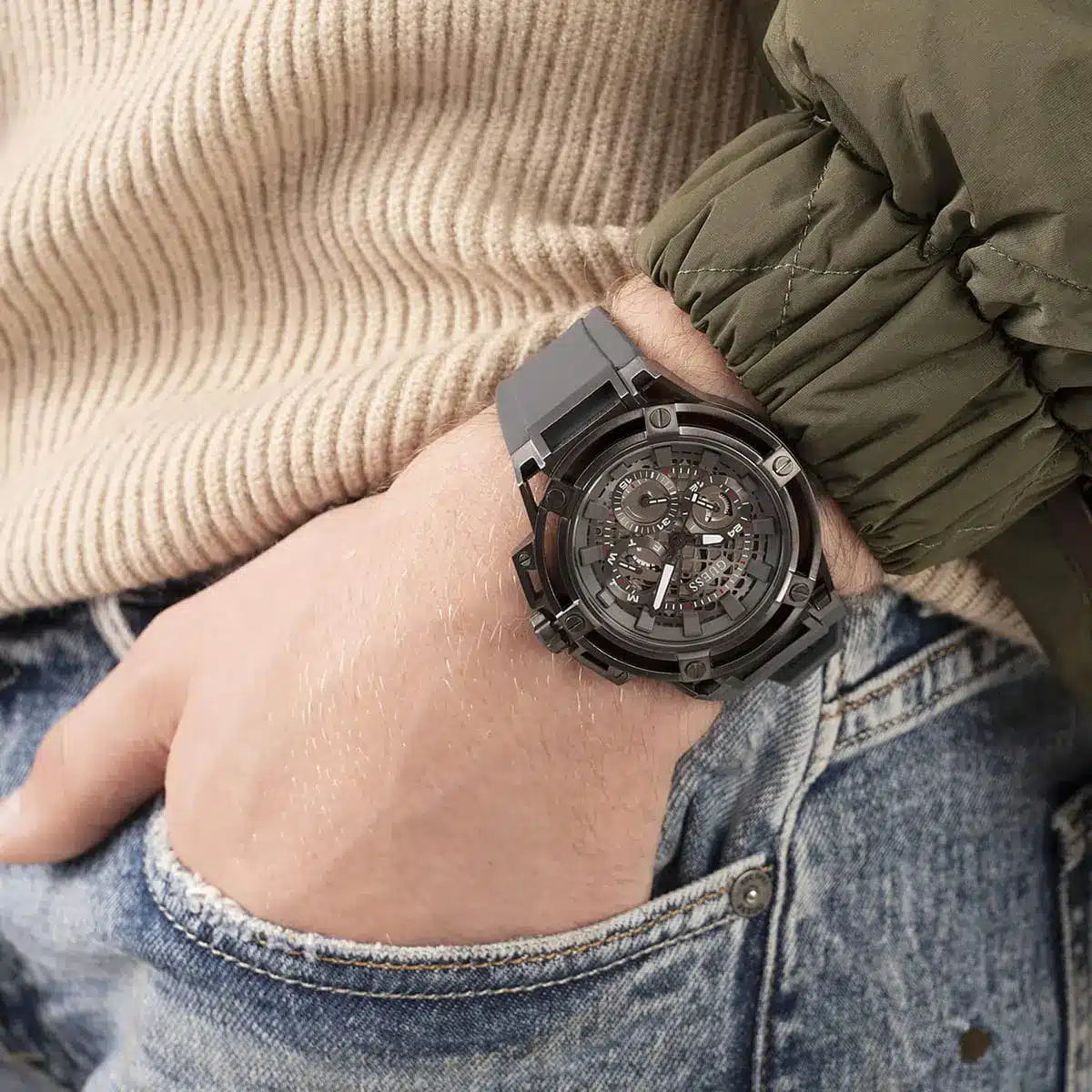 Guess Matrix watch worn on wrist showing skeleton dial and multifunction features