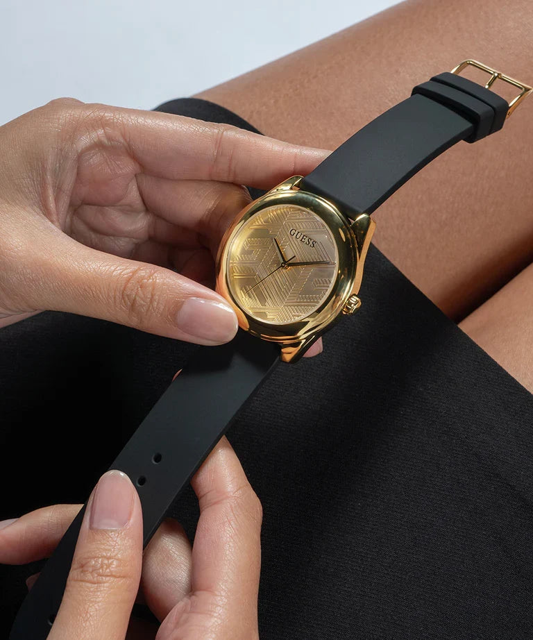 Guess Cubed GW0665L1 watch worn on wrist with black strap and champagne dial