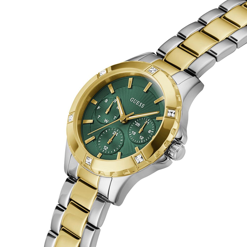 Angled view of Guess Mist watch showing green dial and two-tone steel bracelet detail