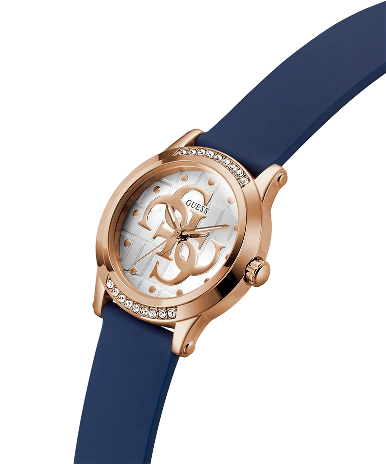 GUESS rose gold watch with navy silicone strap on angled view showing case and bezel detail