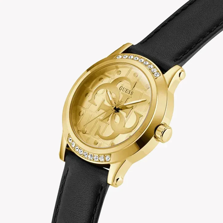 GUESS women's watch on wrist displaying gold case with crystal-set bezel