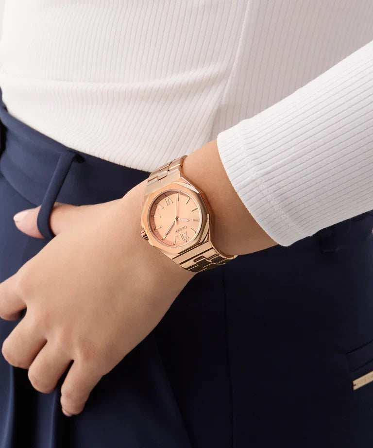 Guess Empress rose gold women's watch on wrist showing dial and bracelet detail