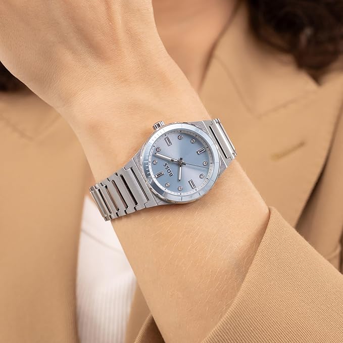 Hugo Boss women's watch worn on wrist showing light blue dial and polished bracelet