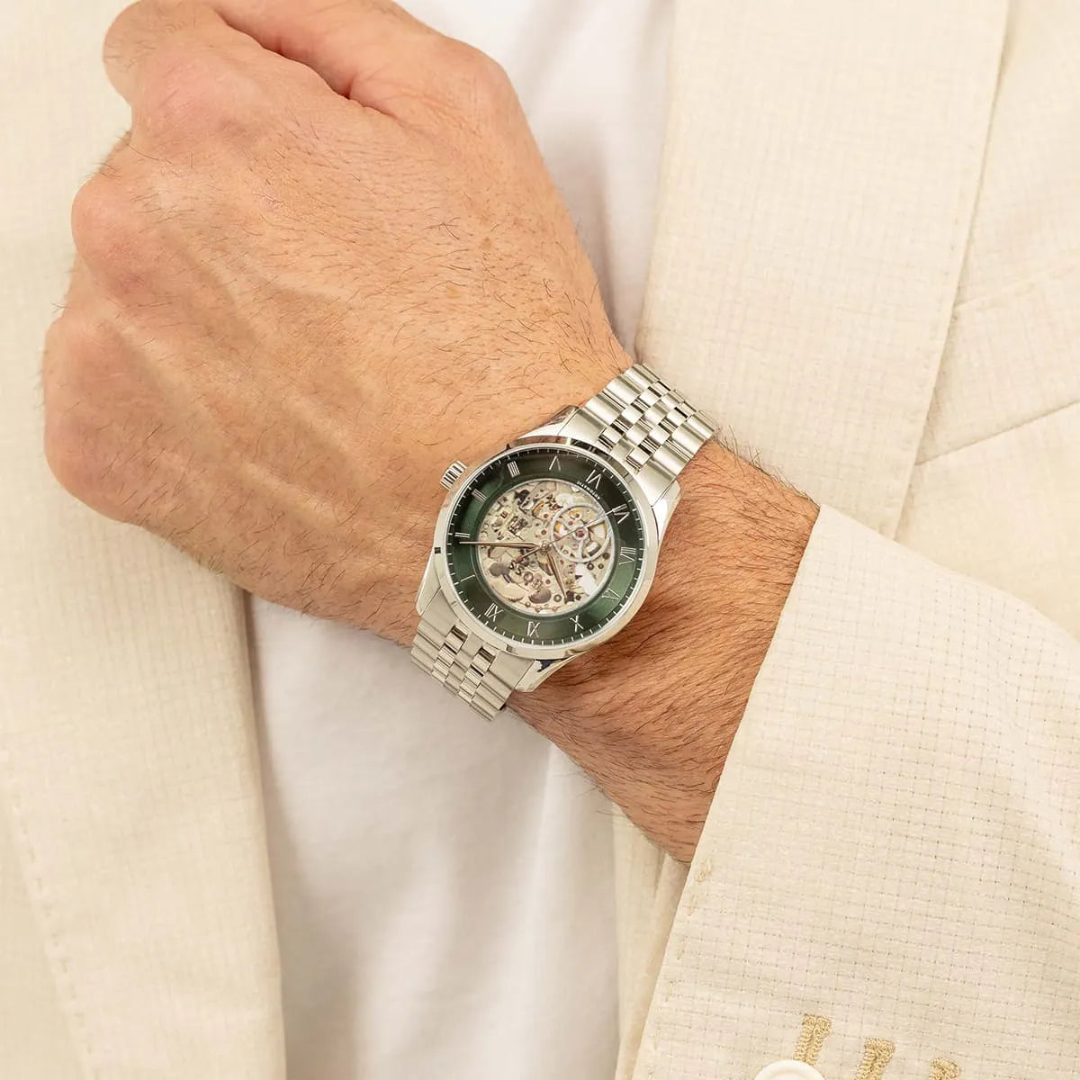 Hugo Boss 1514236 automatic watch worn on wrist showing green dial and skeleton display