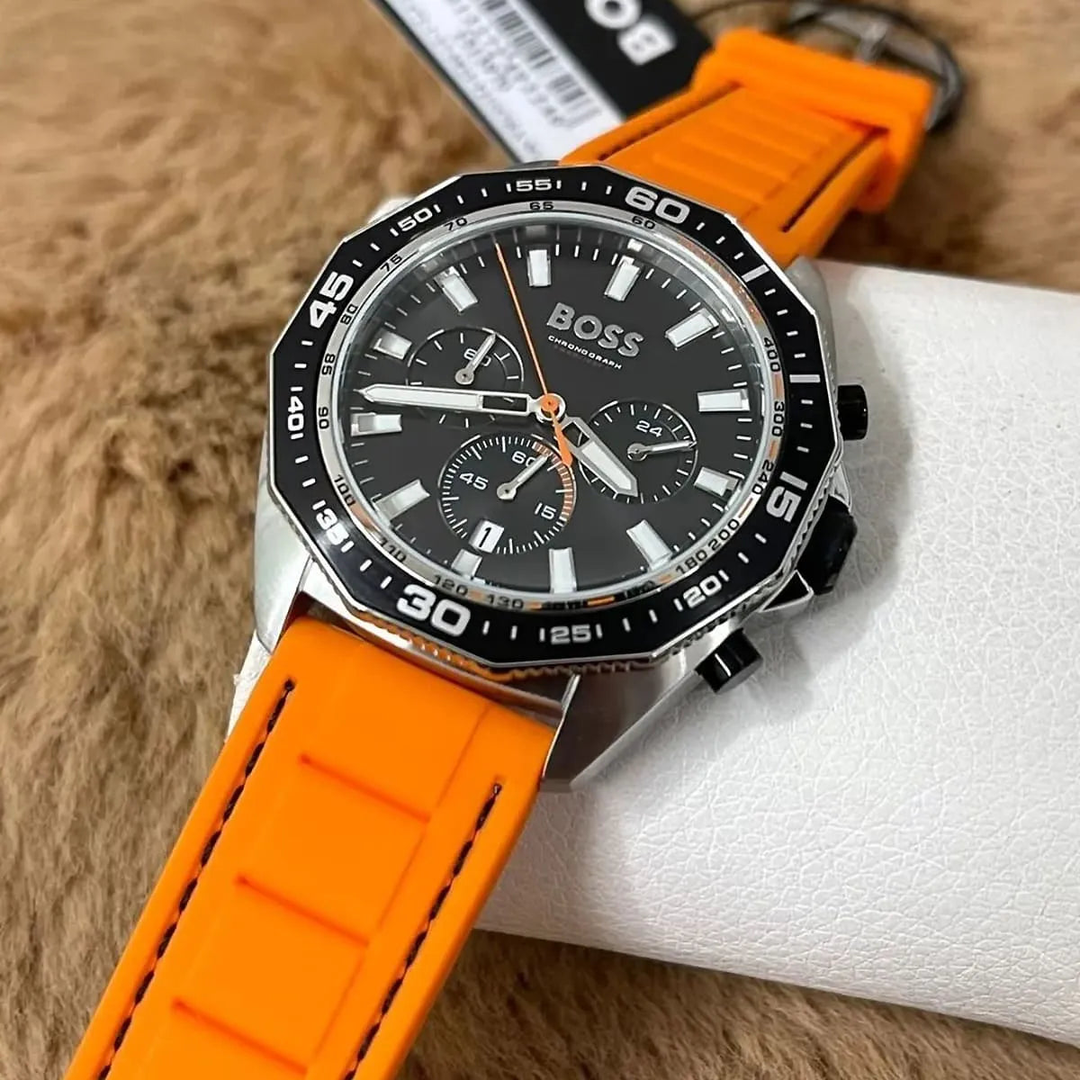 Hugo Boss Energy chronograph with black dial, black bezel, and orange rubber strap