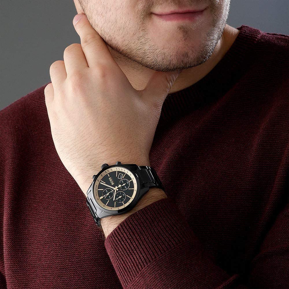 Hugo Boss Grand Prix chronograph worn on wrist showing black IP case with gold accents