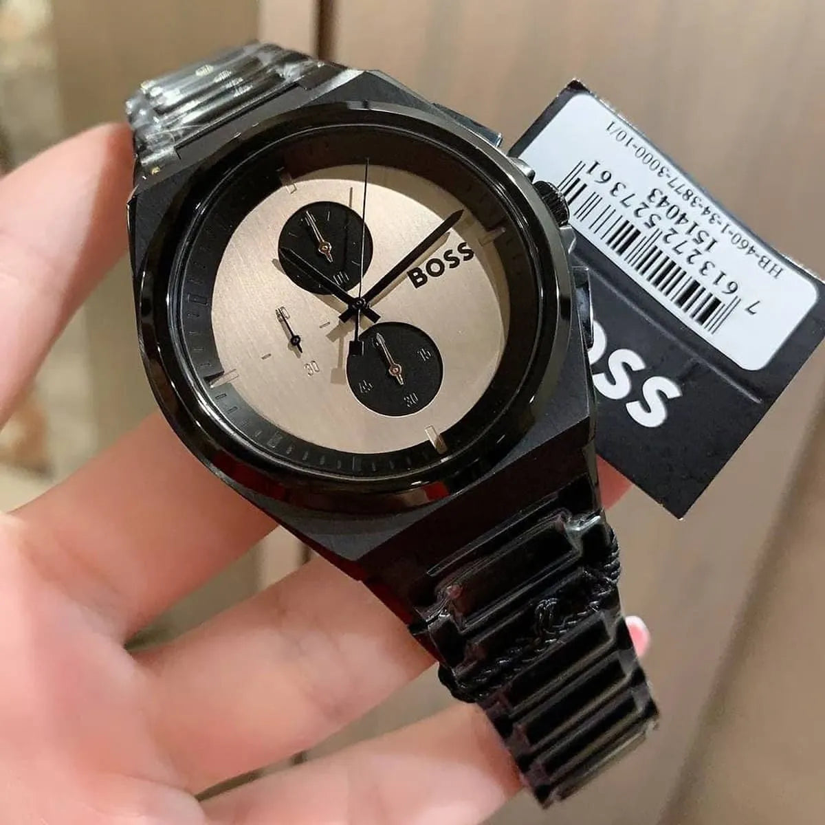 Hugo Boss Steer chronograph watch worn on wrist showing brown dial and black steel bracelet