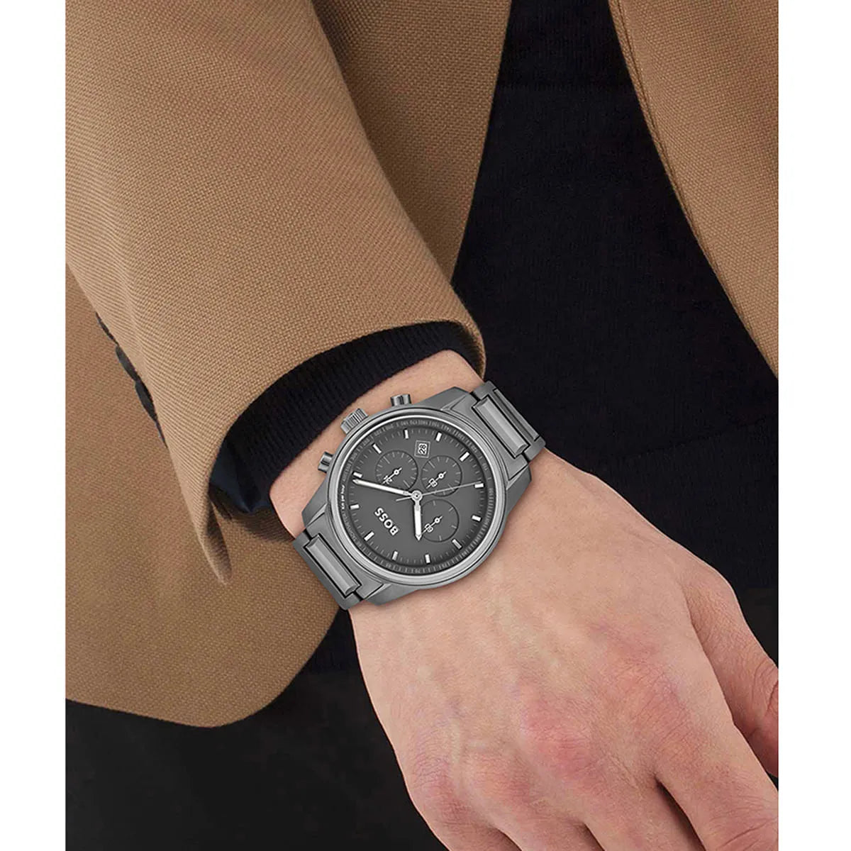 Hugo Boss Trace chronograph watch worn on wrist with grey steel bracelet