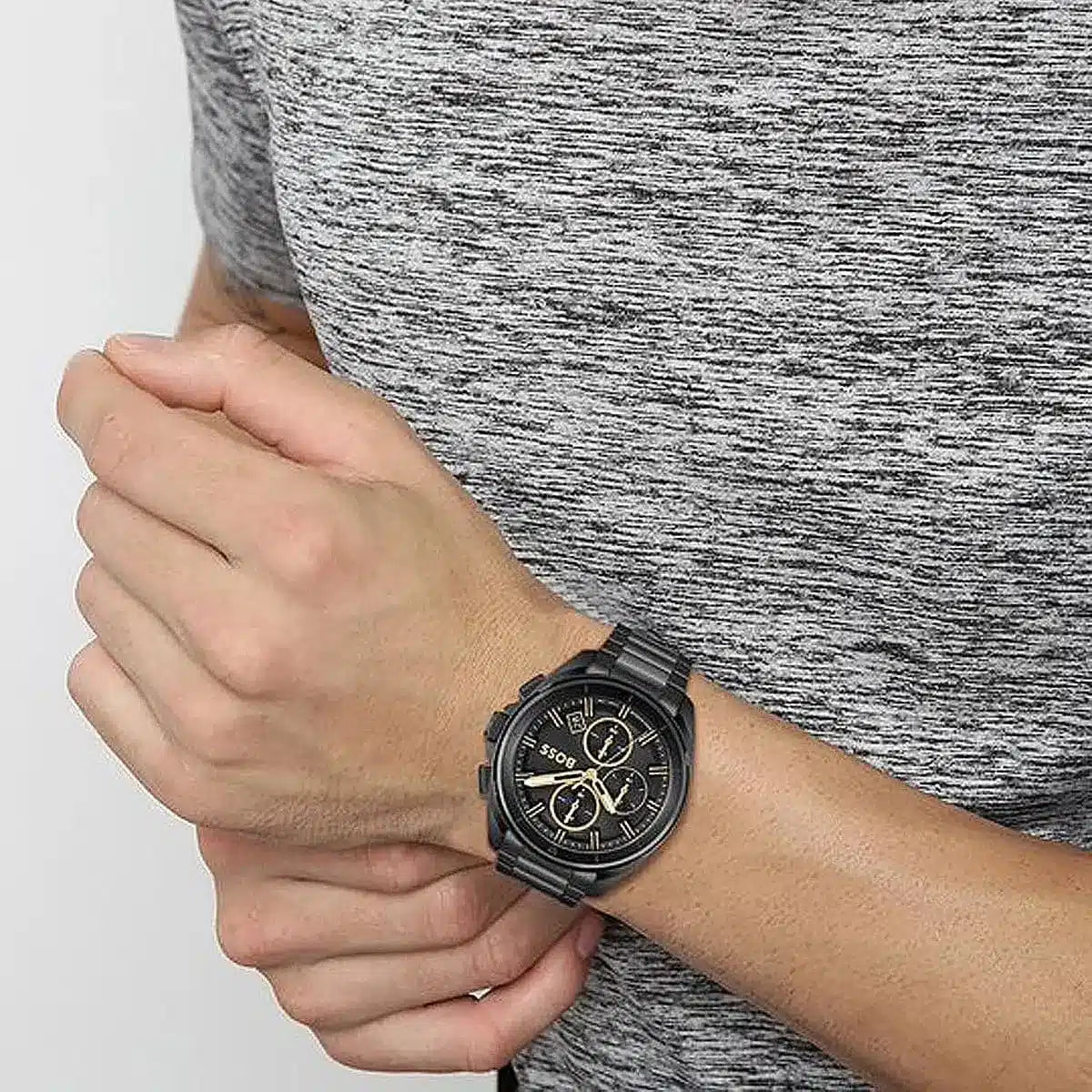 Hugo Boss Volane chronograph watch on wrist showing black dial and stainless steel bracelet detail