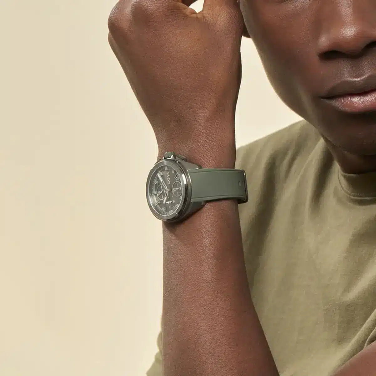 Hugo Boss Volane watch on wrist showing chronograph dial and green strap detail