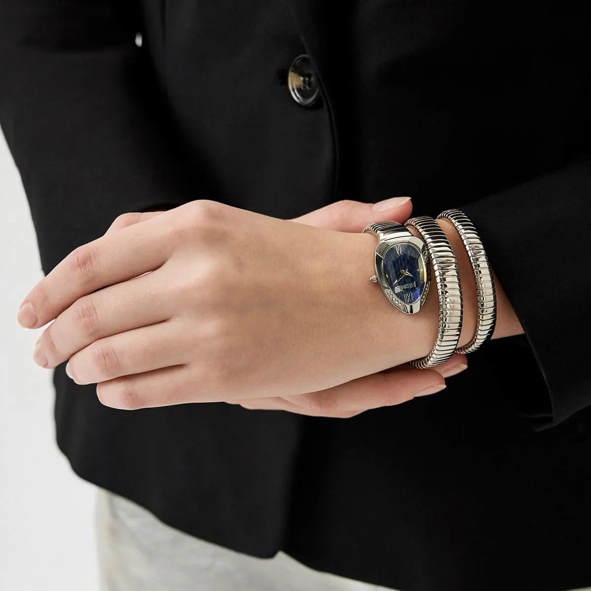Just Cavalli Serpente Metallica watch worn on wrist with silver snake strap and blue dial display