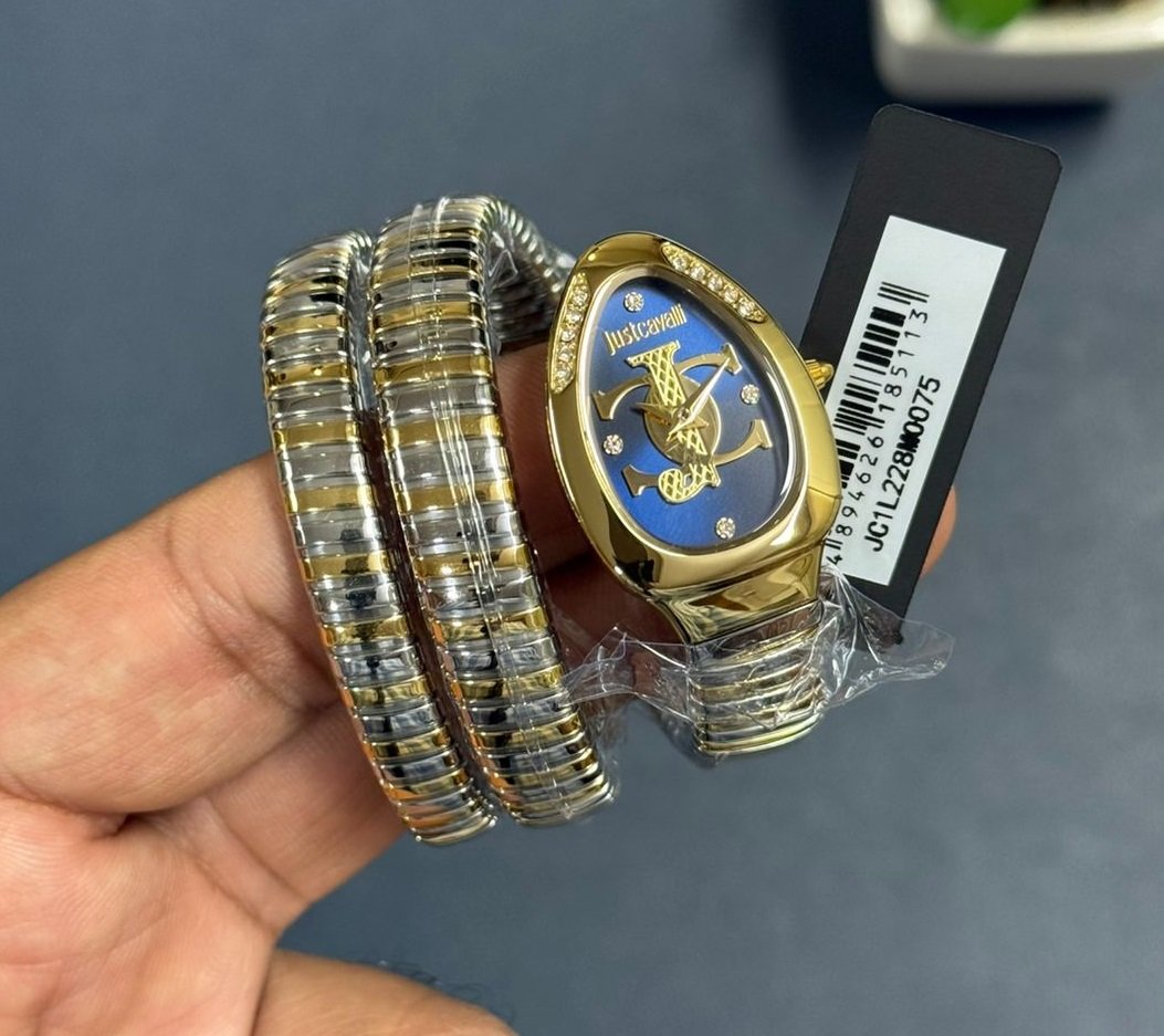 Just Cavalli Glam Evo 5 women's watch on hand with blue dial and two-tone triple-wrap bracelet