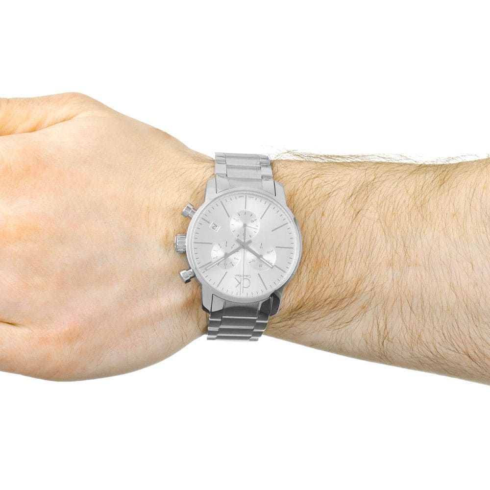 Calvin Klein City chronograph watch worn on wrist with silver bracelet