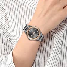 Lacoste Swing women's watch worn on wrist showing black dial and rose gold bezel detail
