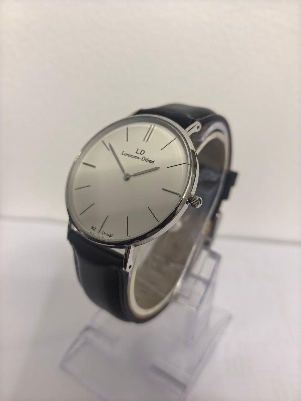 Lorenzen Dilimi slim watch on wrist stand showing side profile with black strap
