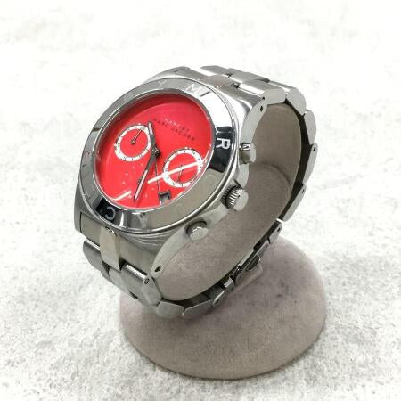 Marc by Marc Jacobs Blade MBM3306 women's watch displayed on stand showing orange dial profile