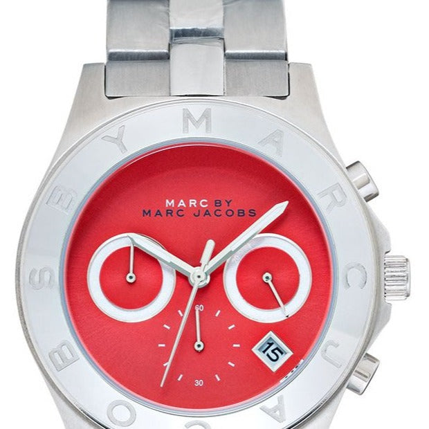Marc by Marc Jacobs Blade MBM3306 watch face with vibrant orange dial and stainless steel bezel