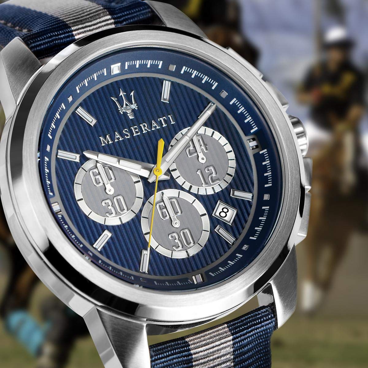 Close-up of Maserati blue dial with three subdials and yellow chronograph hand