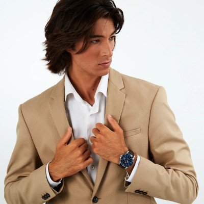 Maserati Competizione diver watch on wrist with blue dial and brown leather strap