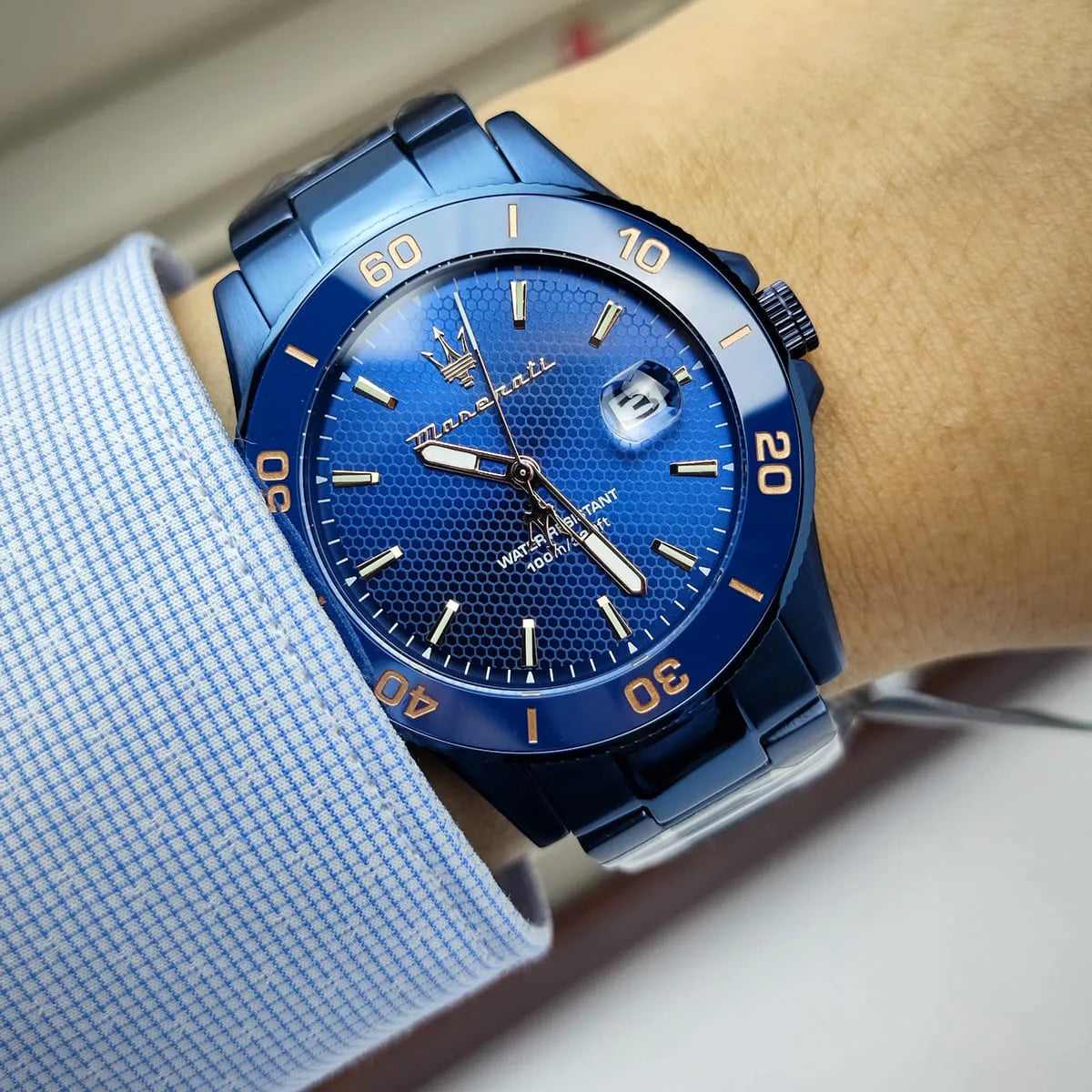 Maserati Competizione watch on wrist showing blue dial with water resistant marking
