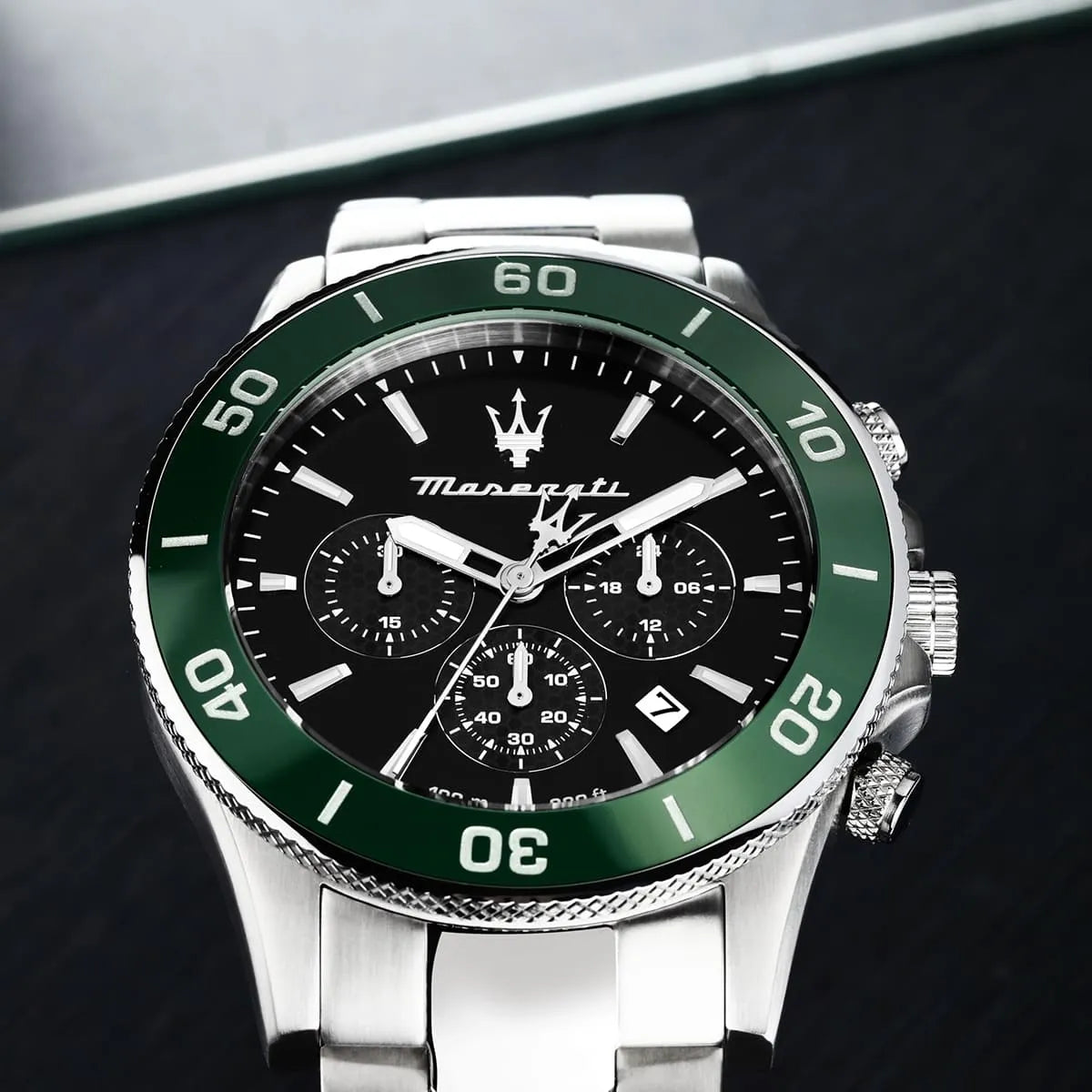 Maserati Competizione dial detail showing chronograph subdials, hour markers, and green bezel