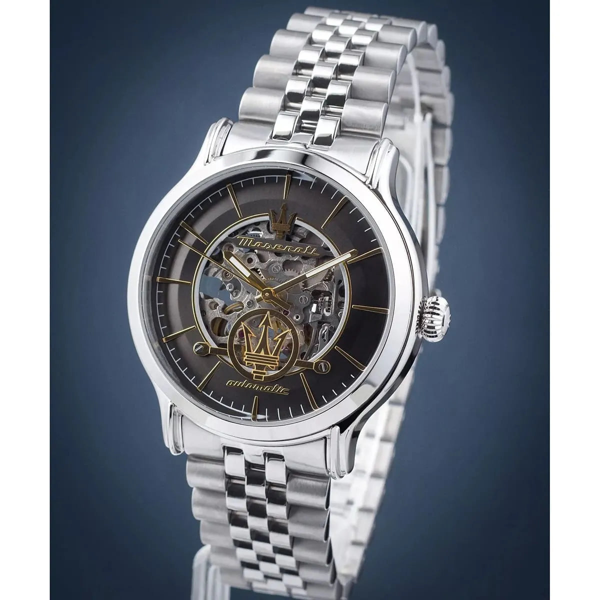 Maserati Epoca skeleton watch with black dial gold hands on blue background