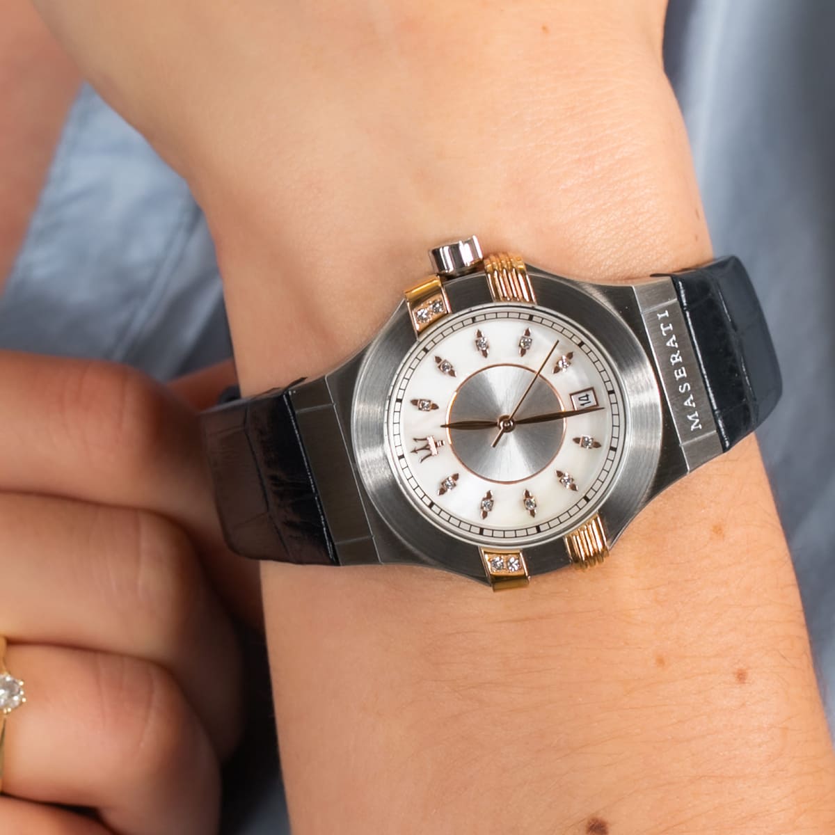 Maserati Potenza ladies watch worn on wrist showing two-tone case and navy leather strap