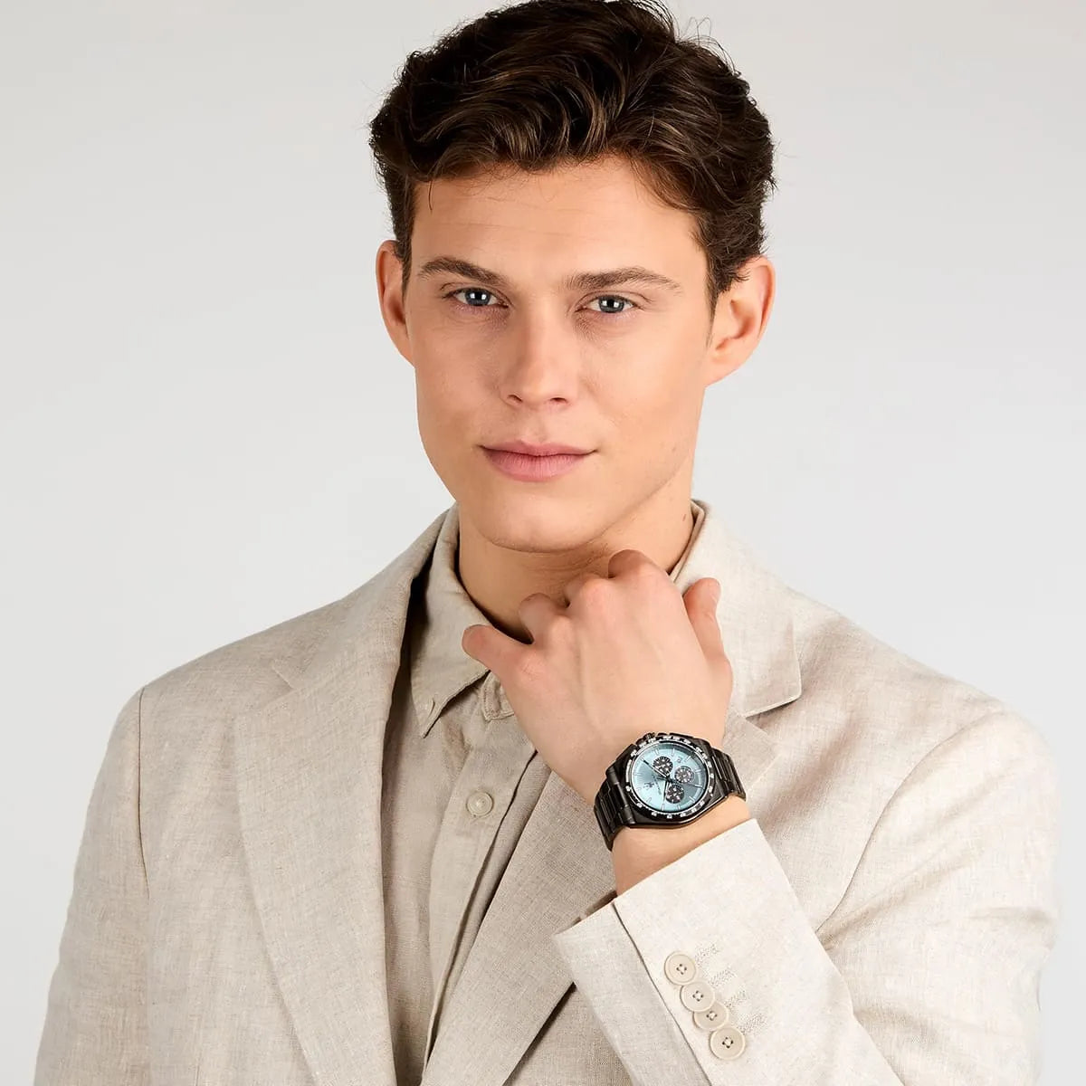 Man wearing Maserati Velocità chronograph watch with light blue dial