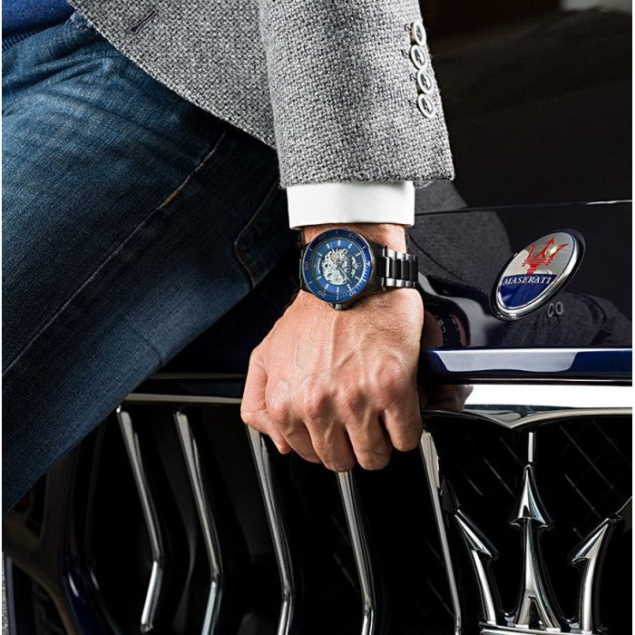 Maserati Sfida watch on wrist paired with Maserati car emblem and formal attire