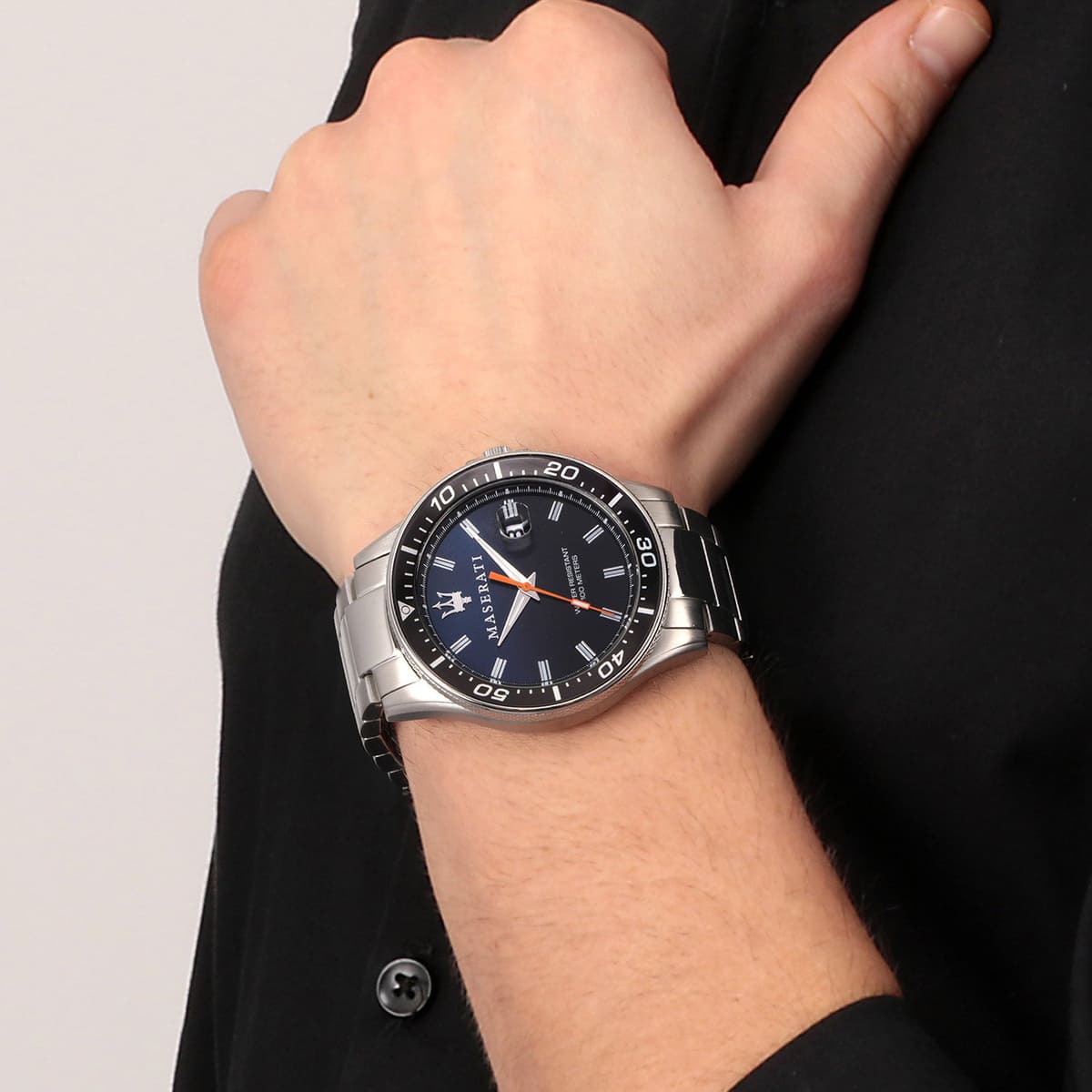 Maserati Sfida watch worn on wrist showing blue dial and silver case