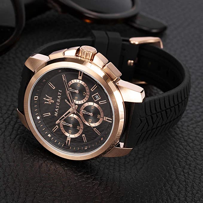 Maserati Successo rose gold chronograph watch on wrist with black rubber strap