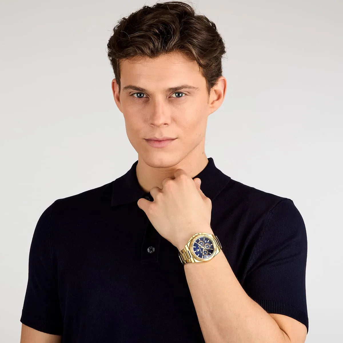 Man wearing Maserati Velocità gold chronograph watch