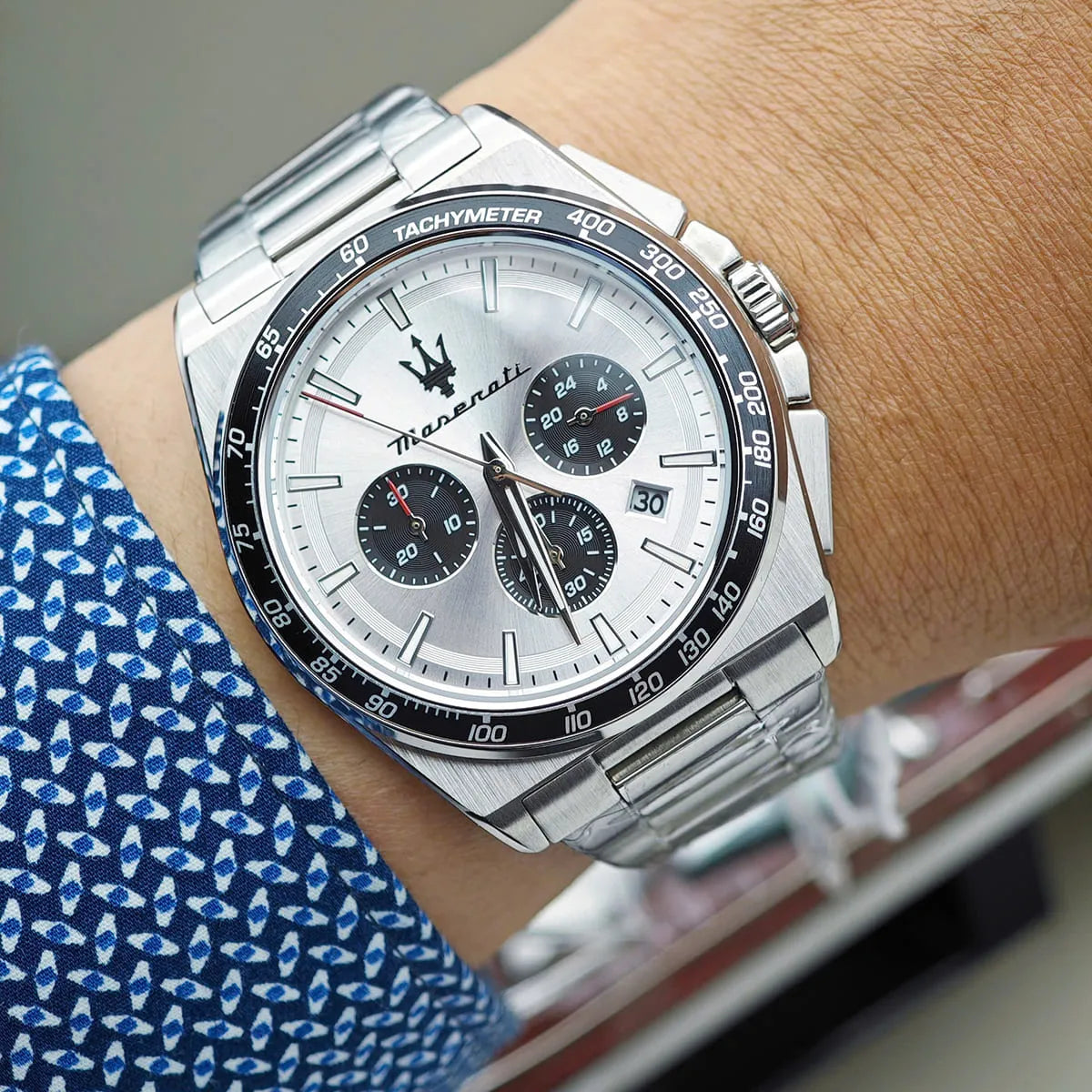 Maserati Velocità chronograph worn on wrist with tachymeter bezel and three black subdials