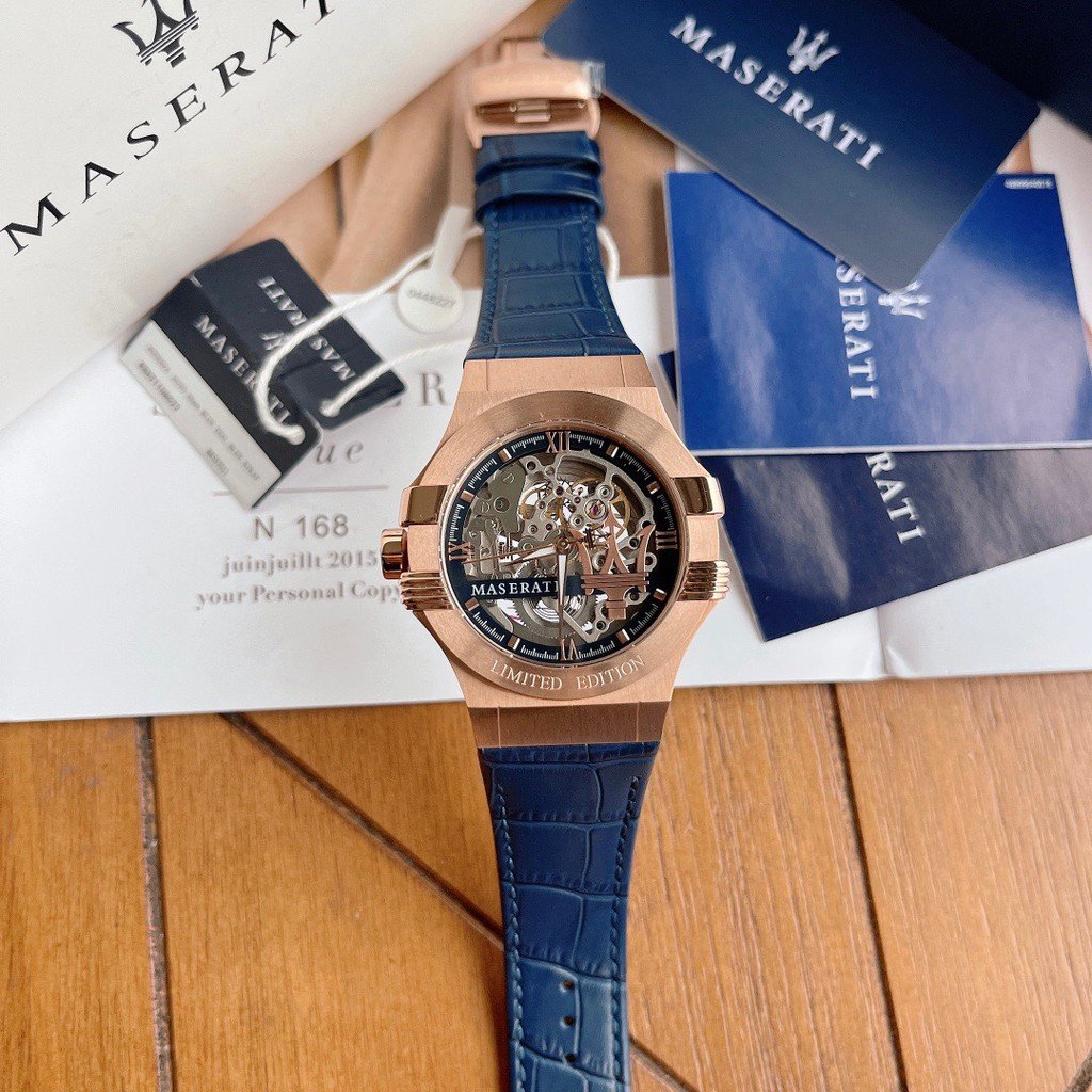 Maserati watch with complete set of documentation, warranty cards, and blue branded packaging