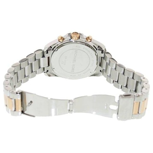 Caseback of Michael Kors Bradshaw watch with steel and rose gold bracelet visible