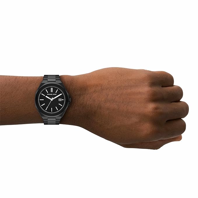 Michael Kors Callum watch worn on wrist with black stainless steel bracelet