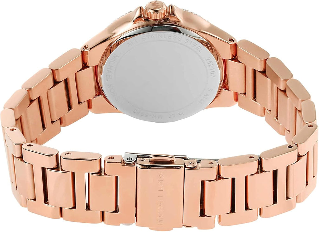 Michael Kors Camille watch worn on wrist, displaying rose gold case and dark grey dial