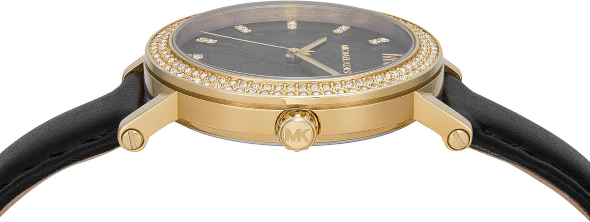 Side view of Michael Kors Corey watch showing gold-tone case profile and black strap