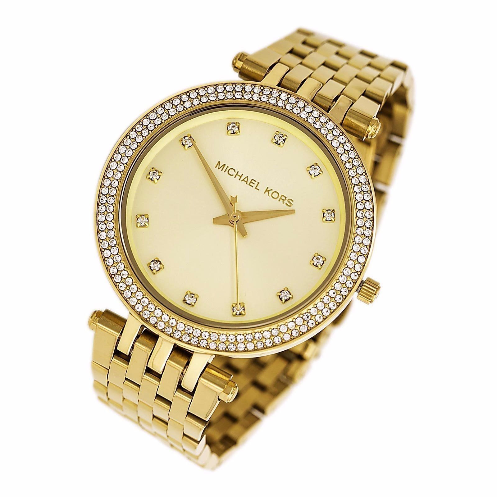 Angled view of Michael Kors Darci gold watch showing face and link bracelet
