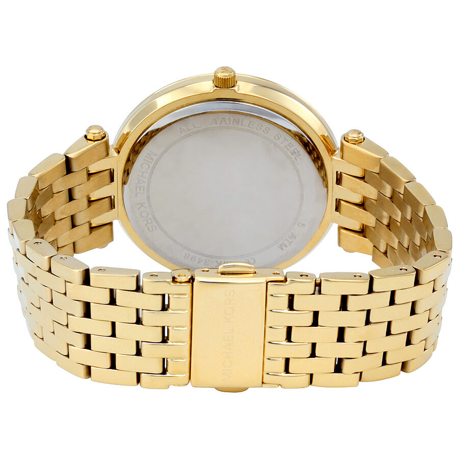 Michael Kors Darci watch caseback showing gold-tone stainless steel and engraved details
