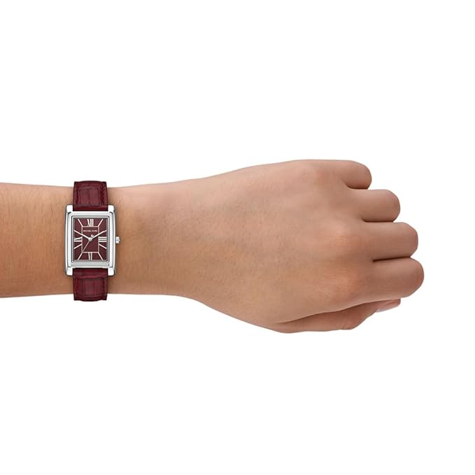 Michael Kors ESSEX MK4966 red leather watch worn on wrist showing rectangular case
