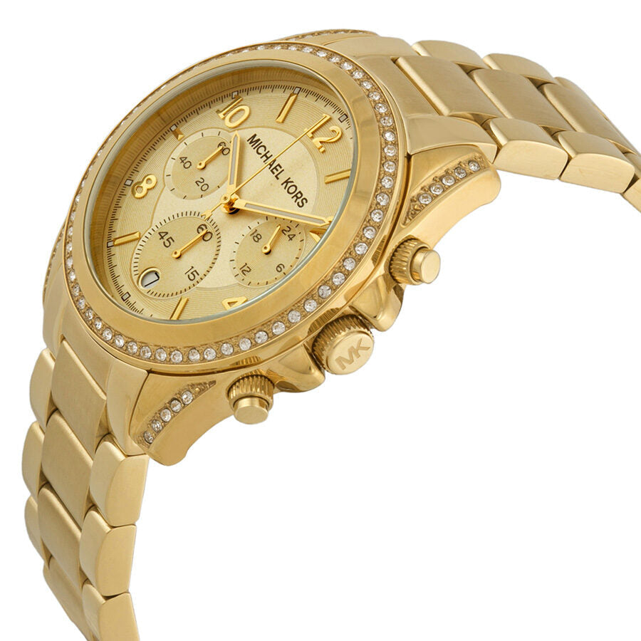 Gold chronograph watch with crystal bezel and champagne dial, angled side view