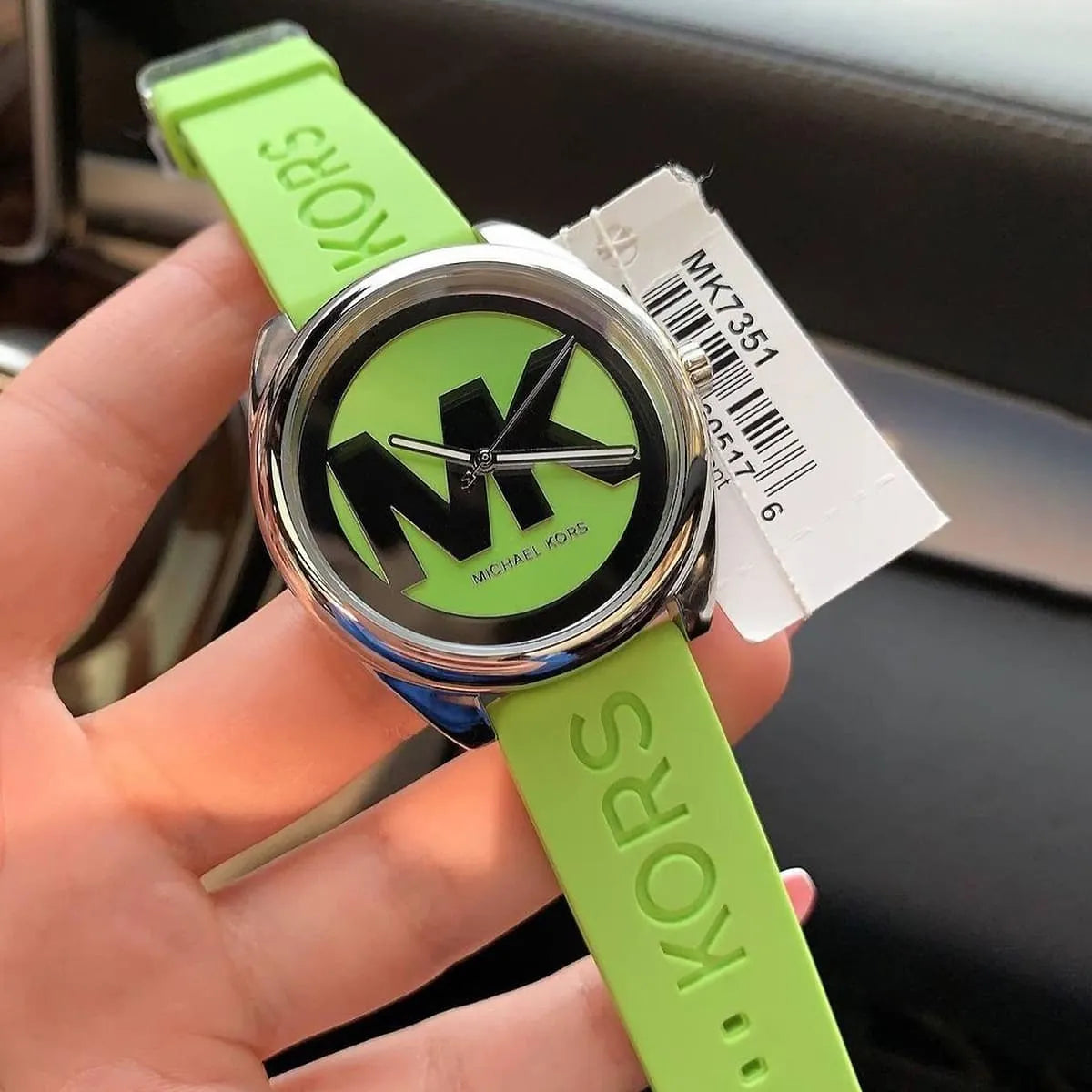 Michael Kors Janelle watch worn on wrist with neon green strap and dial