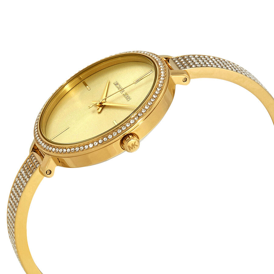 Michael Kors Jaryn gold watch side view showing ultra-slim case and pavé bracelet