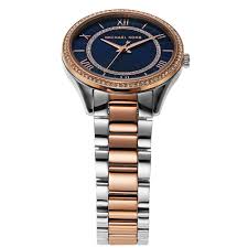Michael Kors Lauryn watch shown from angled overhead view with blue dial and two-tone bracelet